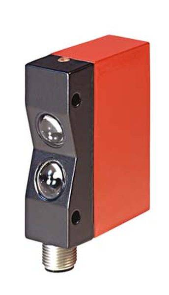 A rectangular red and black sensor with two round elements on the front and a metal connection at the bottom.