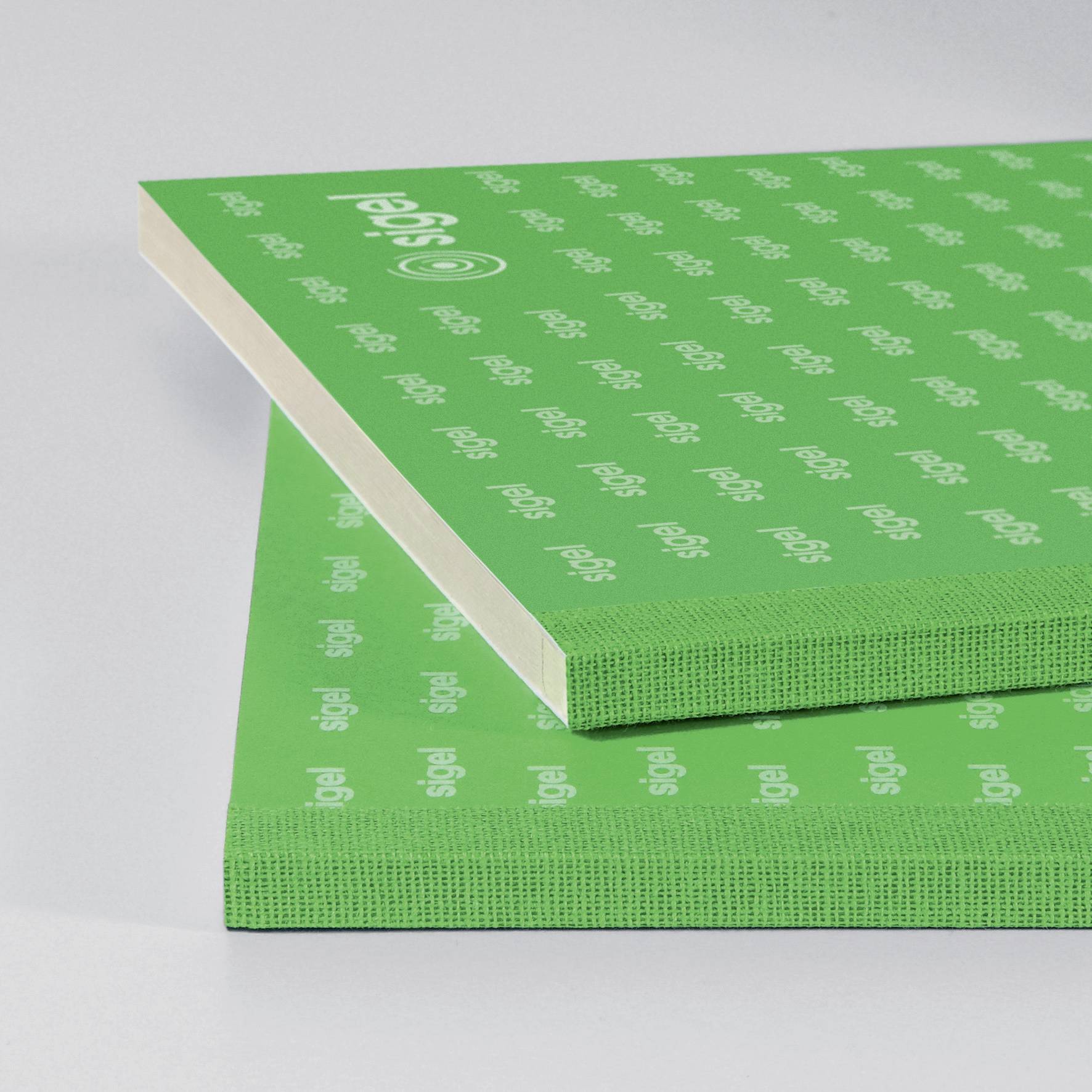 Two green notepads with the 'sigel' logo, stacked on a grey background.