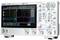 Digital oscilloscope with multiple buttons and a screen displaying waveforms and measurement data in real time.