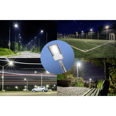 Street lighting at night, showing a road, a football pitch, and a car park with glare-free LED lamps for improved visibility.