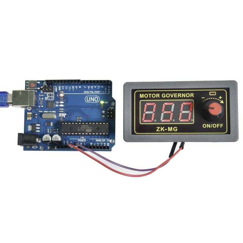 Arduino board connected with a digital motor speed controller. Left: blue board with USB port; Right: display showing 'MOTOR GOVERNOR', indicates ZK-MG.