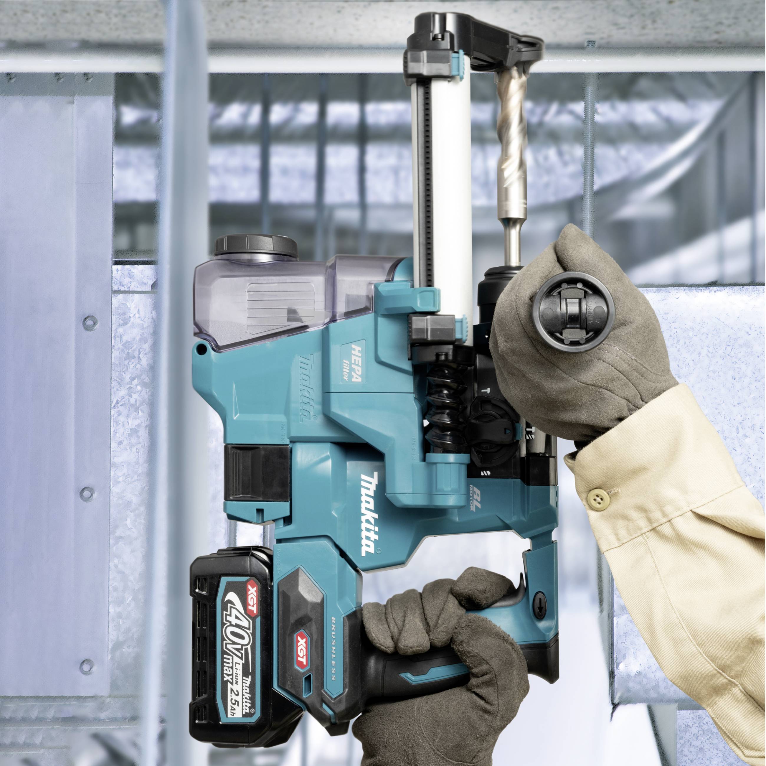 A person is using a cordless drill to work on a metal beam. The machine is blue and black.