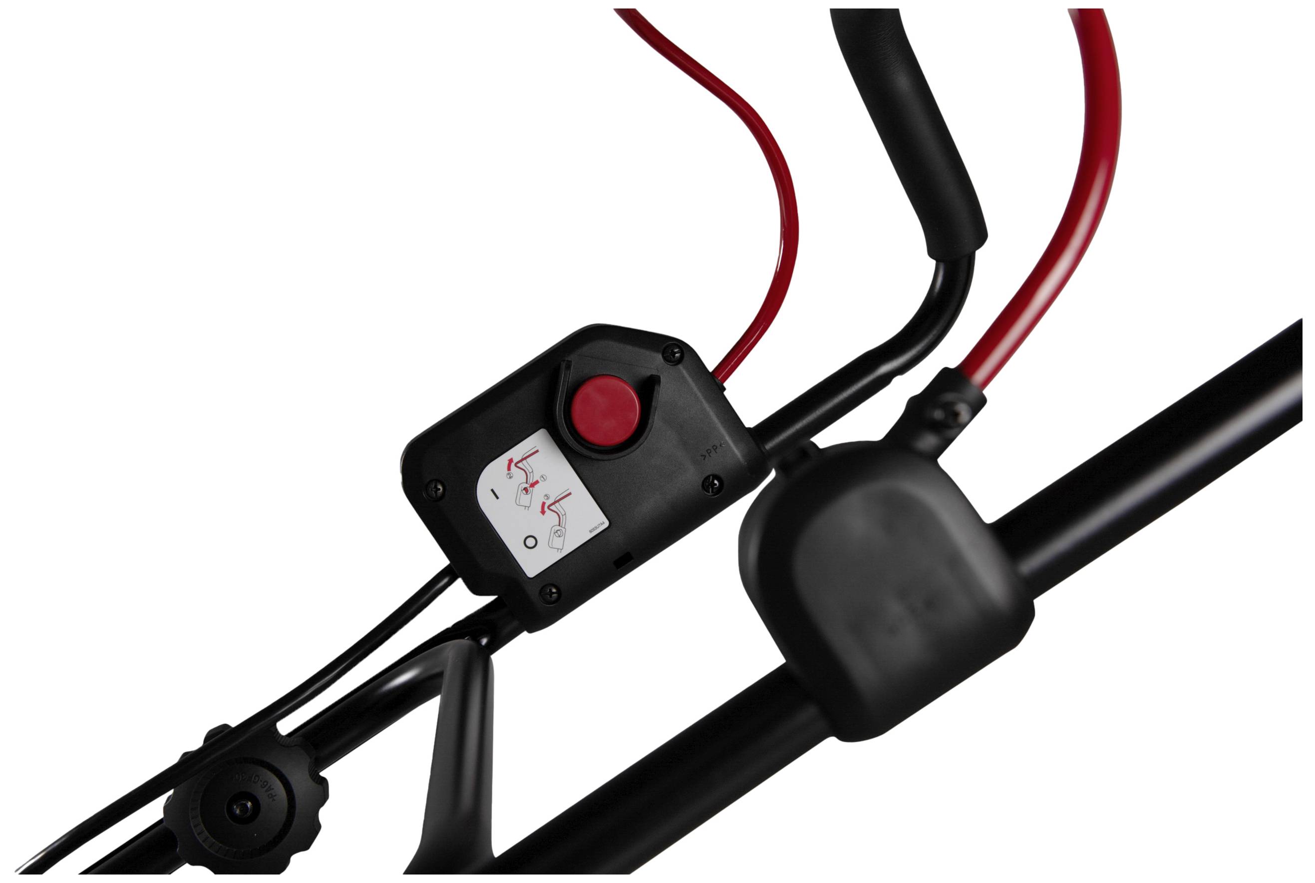 Close-up of a black and red control lever with a red button and electrical switch, possibly from a garden tool.