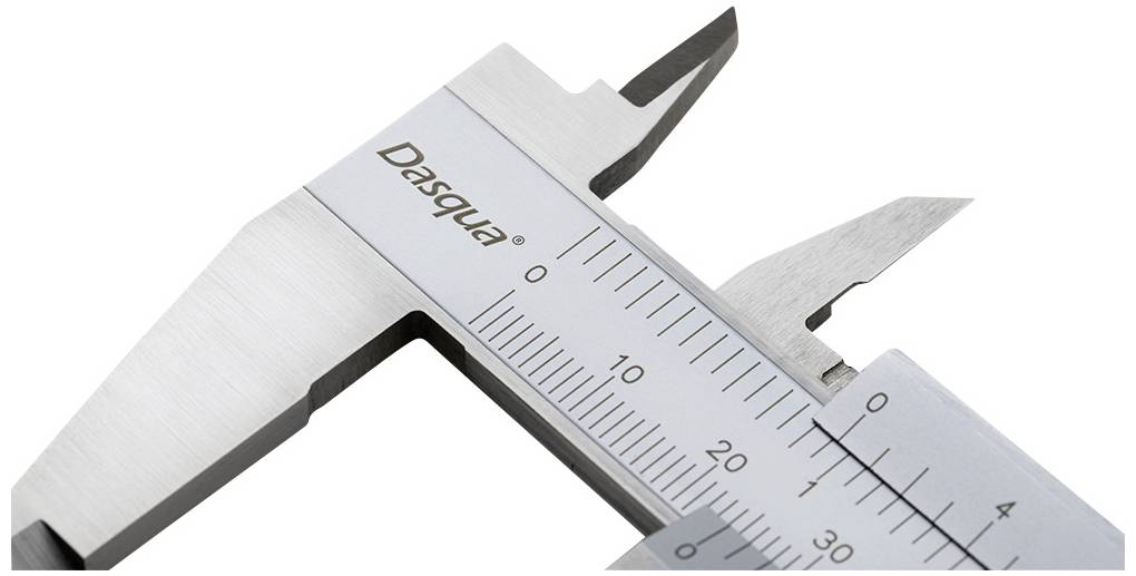 A calliper with a scale in millimetres and inches for precise measurement of objects.