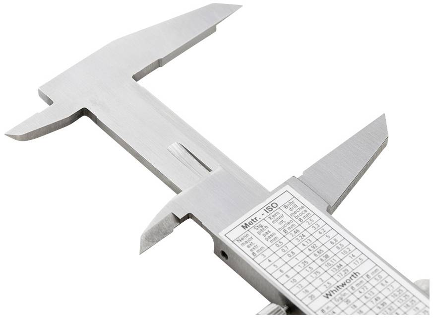 A metal vernier calliper shows metric and imperial scales. Ideal for precise measurement of diameters and distances in engineering and craftsmanship.