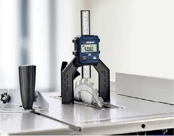 An electronic calliper measures the height of a saw blade on a table. Display shows '50.80'.