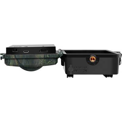 An opened wildlife camera housing with camouflage pattern; visible are connections and a slot for memory cards.