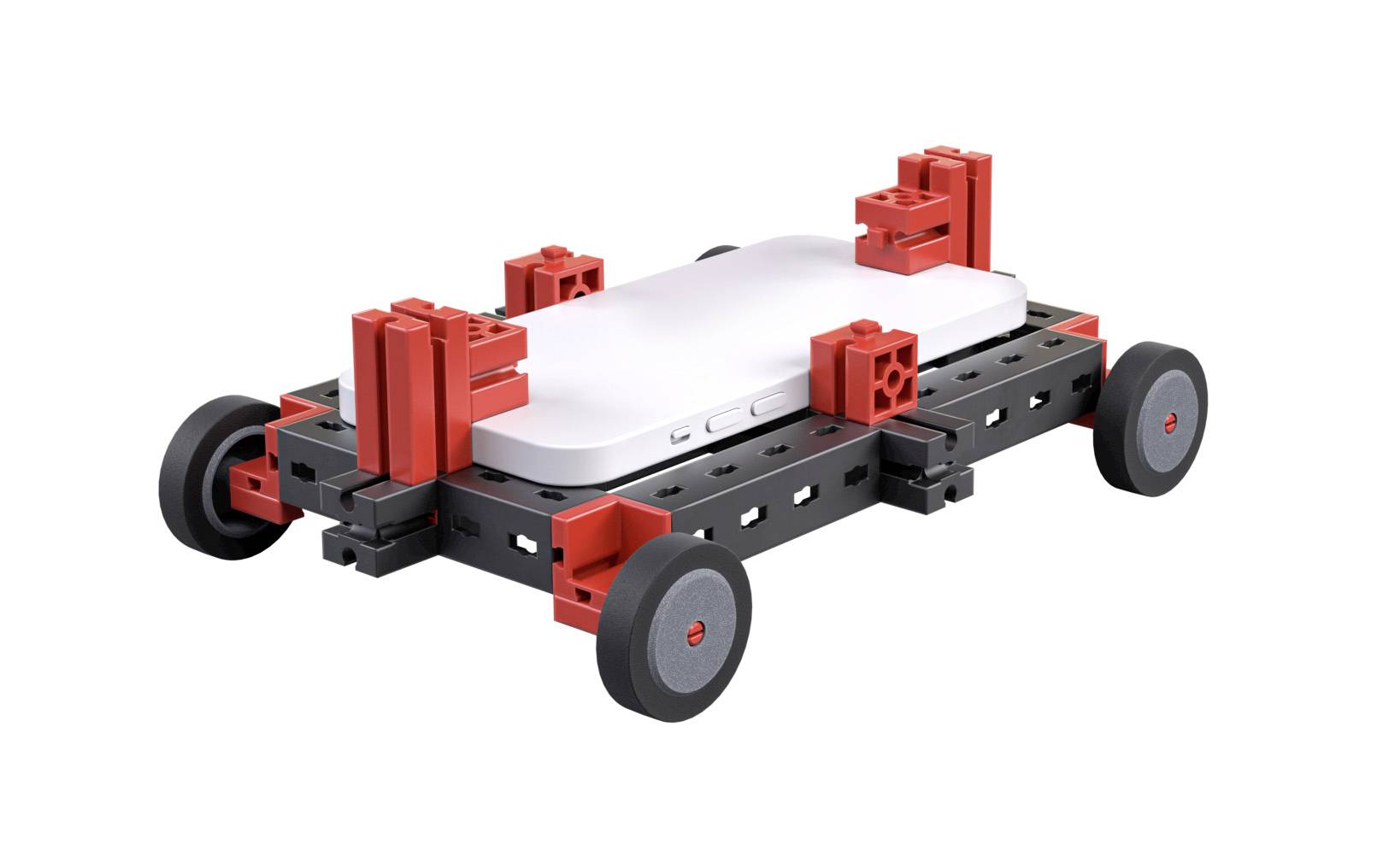 A small robot made of black and red plastic parts with four wheels, with a white, rectangular plate mounted on top.