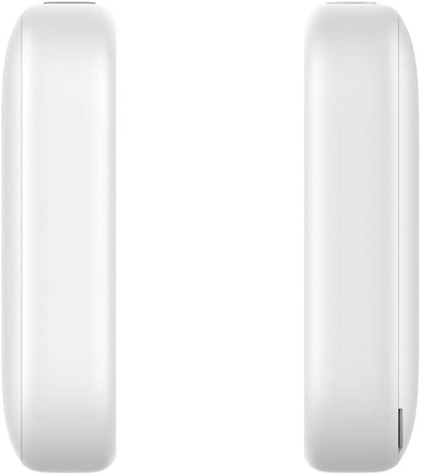 Two white, circular devices are lying side by side on a surface, viewed from the side.