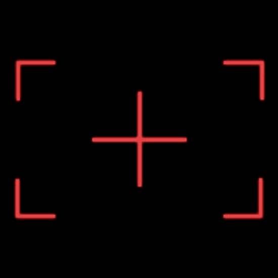 Red crosshair marker on a black background, typically used for target acquisition in cameras or electronic devices.