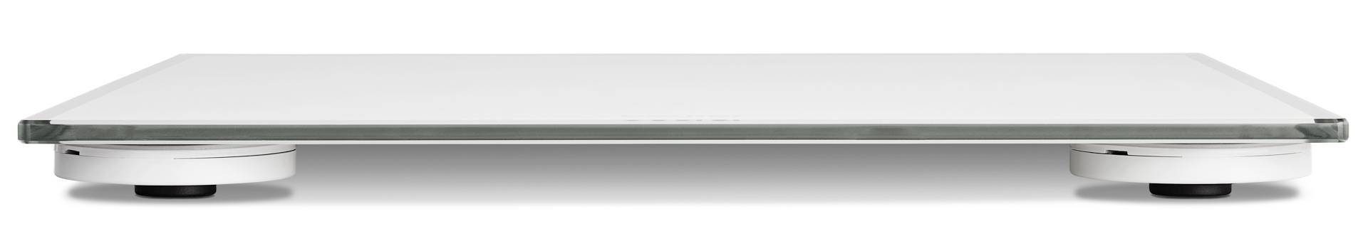 A white, rectangular monitor stand made of metal and glass, mounted on two round, height-adjustable legs.