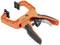 Orange quick-release G-clamp with black handle and quick-release mechanism, suitable for securing workpieces.