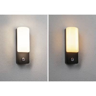 Two wall lights on a wall; the left lamp emits a white light, the right one a warm yellow. Both have rectangular shades.