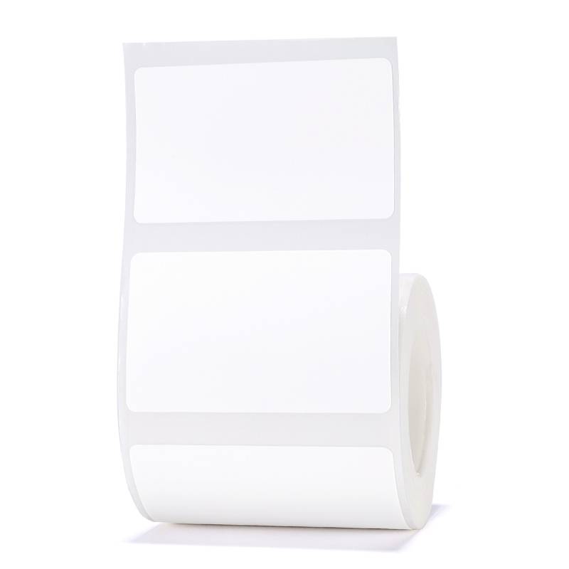 A roll of rectangular white labels on a table.