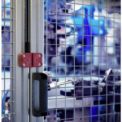 Metal grille with security lock against a blurred factory background; emphasises security and access control in an industrial setting.