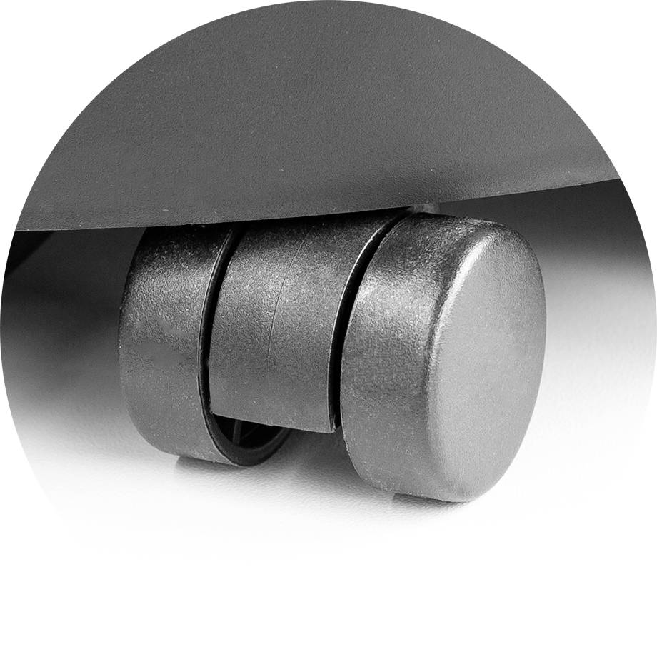 Office chair castor in close-up; black, swivel wheels on a smooth floor.