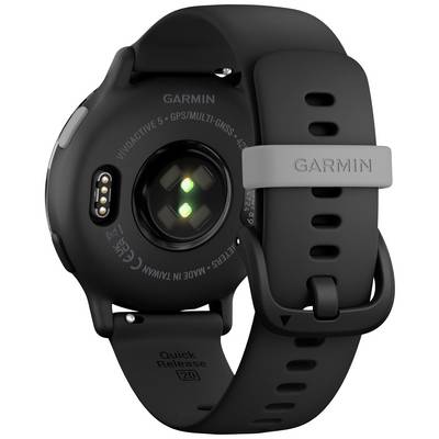 Back of a black smartwatch with a green LED and Garmin logo on the wristband.