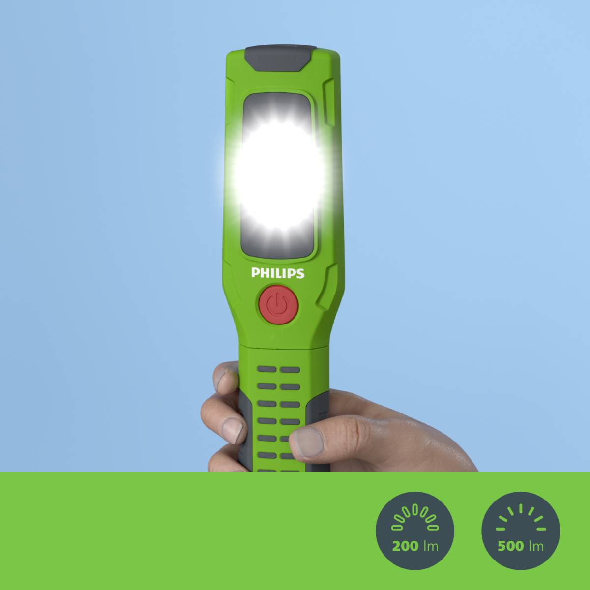 Portable green Philips torch held in hand. Shining brightly. Symbols indicate brightness: 200 lumens and 500 lumens modes.
