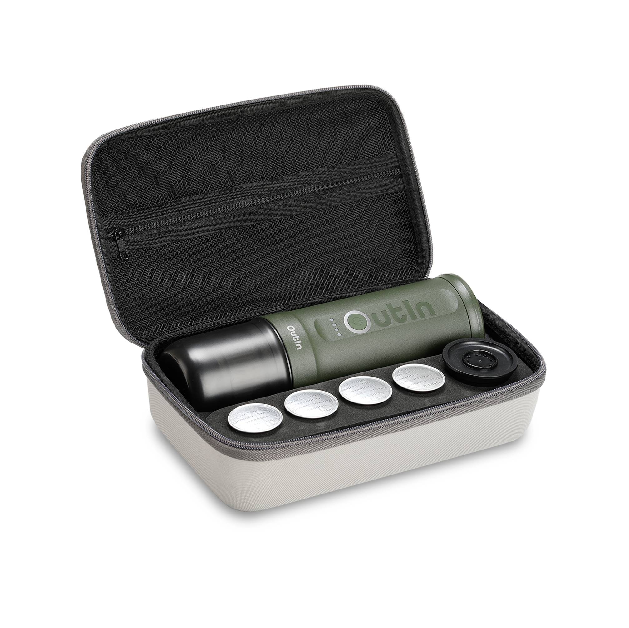 A green, portable coffee machine set in an open bag, containing a machine, five capsules, and a lid. Perfect for on the go.