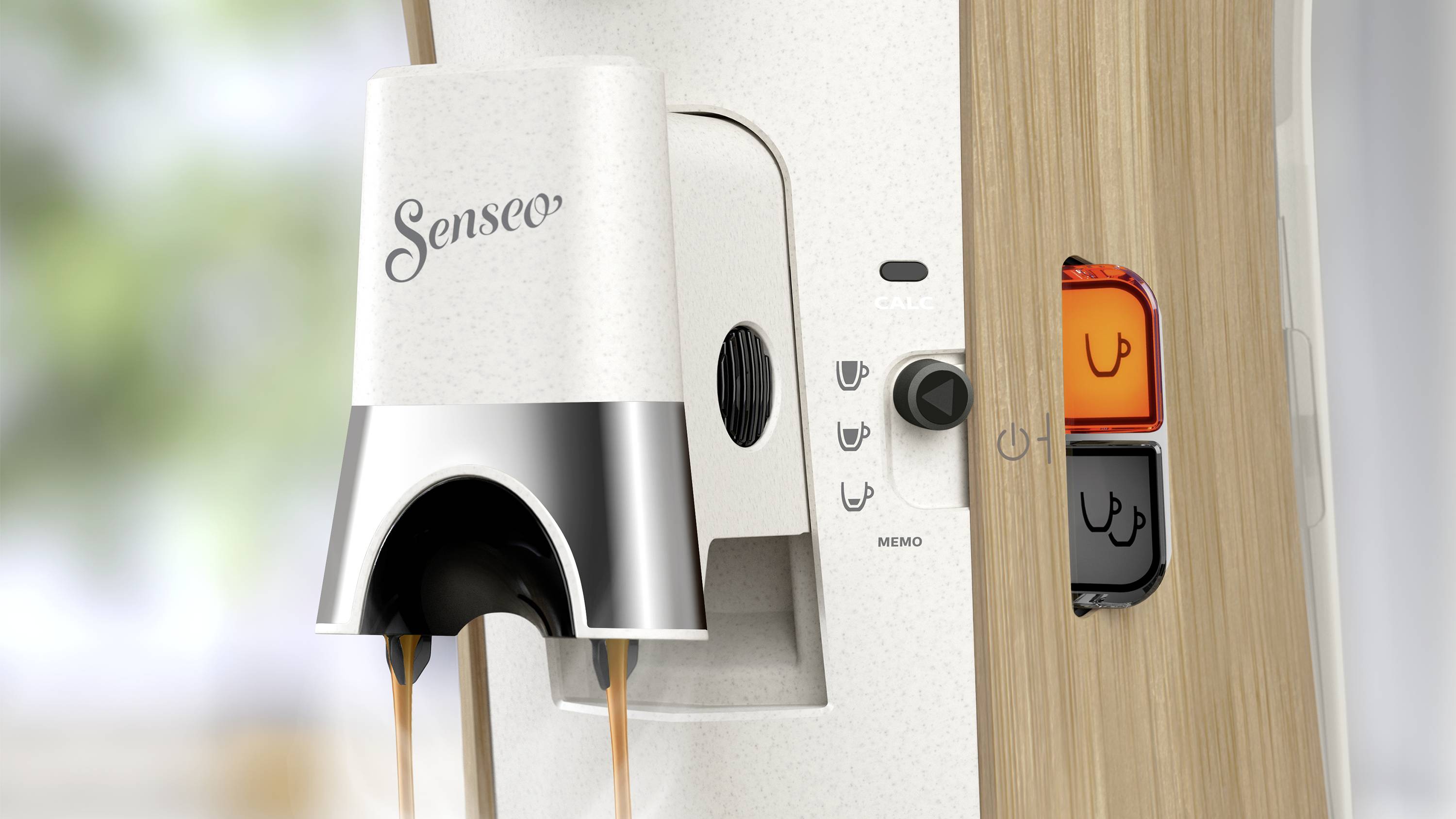 Coffee machine with 'Senseo' logo and two illuminated buttons, with one blinking. Coffee flows from the outlet in two simultaneous streams.