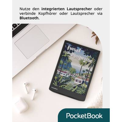 On a table lie a laptop, wireless headphones and a tablet displaying a 'Travel Magazine'. At the top it states that an integrated speaker or Bluetooth can be used.