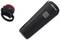Black bicycle light set, consisting of a large, elongated front light with a grey button and a smaller rear light.