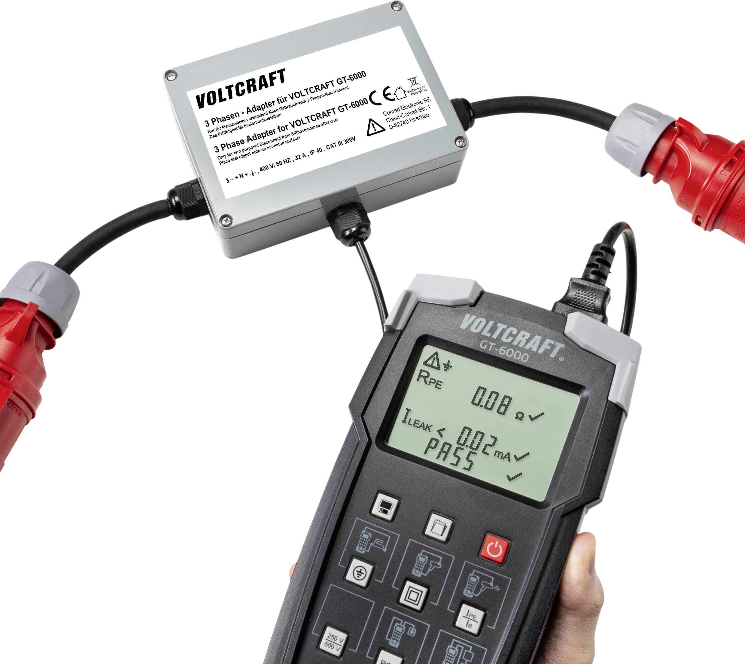 A handheld device shows test results. The screen displays 'PASS' and measurement values. Connected to a three-phase adapter.