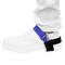 'A person is wearing a white work shoe with a blue, anti-static grounding strap over the ankle against a white background.'