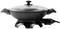 Electric frying pan with glass lid and side handles. The pan is black and features an integrated temperature control.
