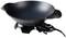Electric wok pan with temperature control, black design. Ideal for frying and cooking, placed on a table.
