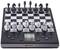 Electronic chess board with black and white chess pieces, digital display and control buttons.