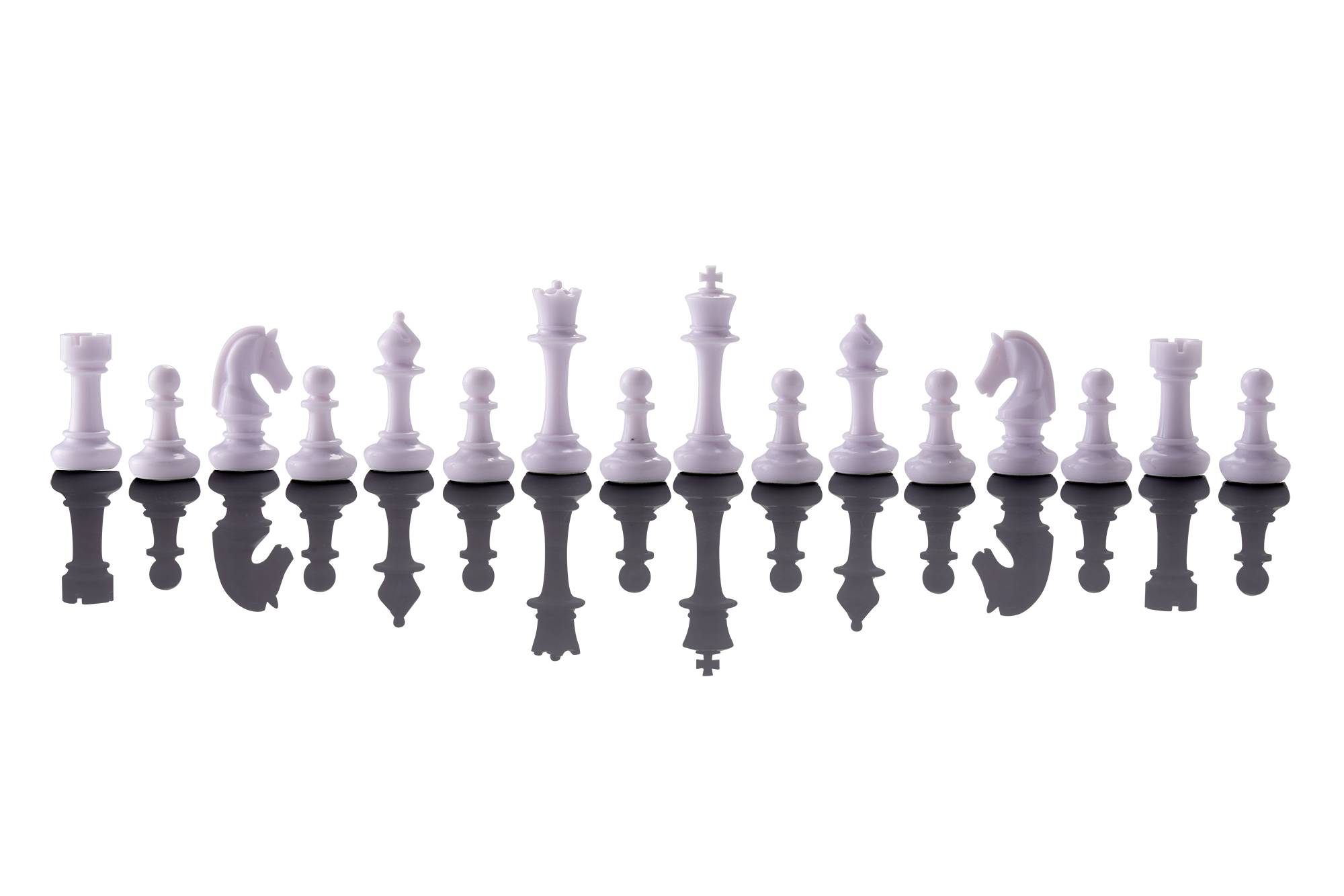 A row of white chess pieces stands in a reflection, showing all pieces from pawn to king.