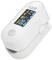 A white pulse oximeter with a digital display shows 'SpO2 98%' and 'PR bpm 72'. It measures oxygen saturation and pulse rate.