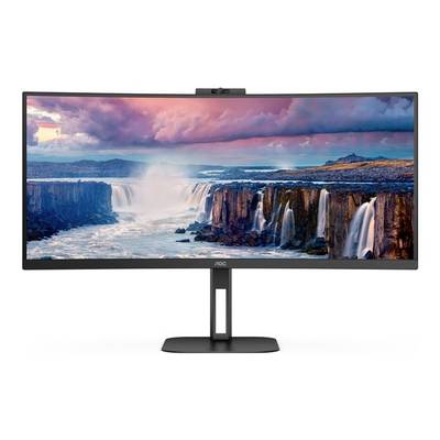 An ultra-wide monitor displays a breathtaking landscape with waterfalls and a colourful sky.