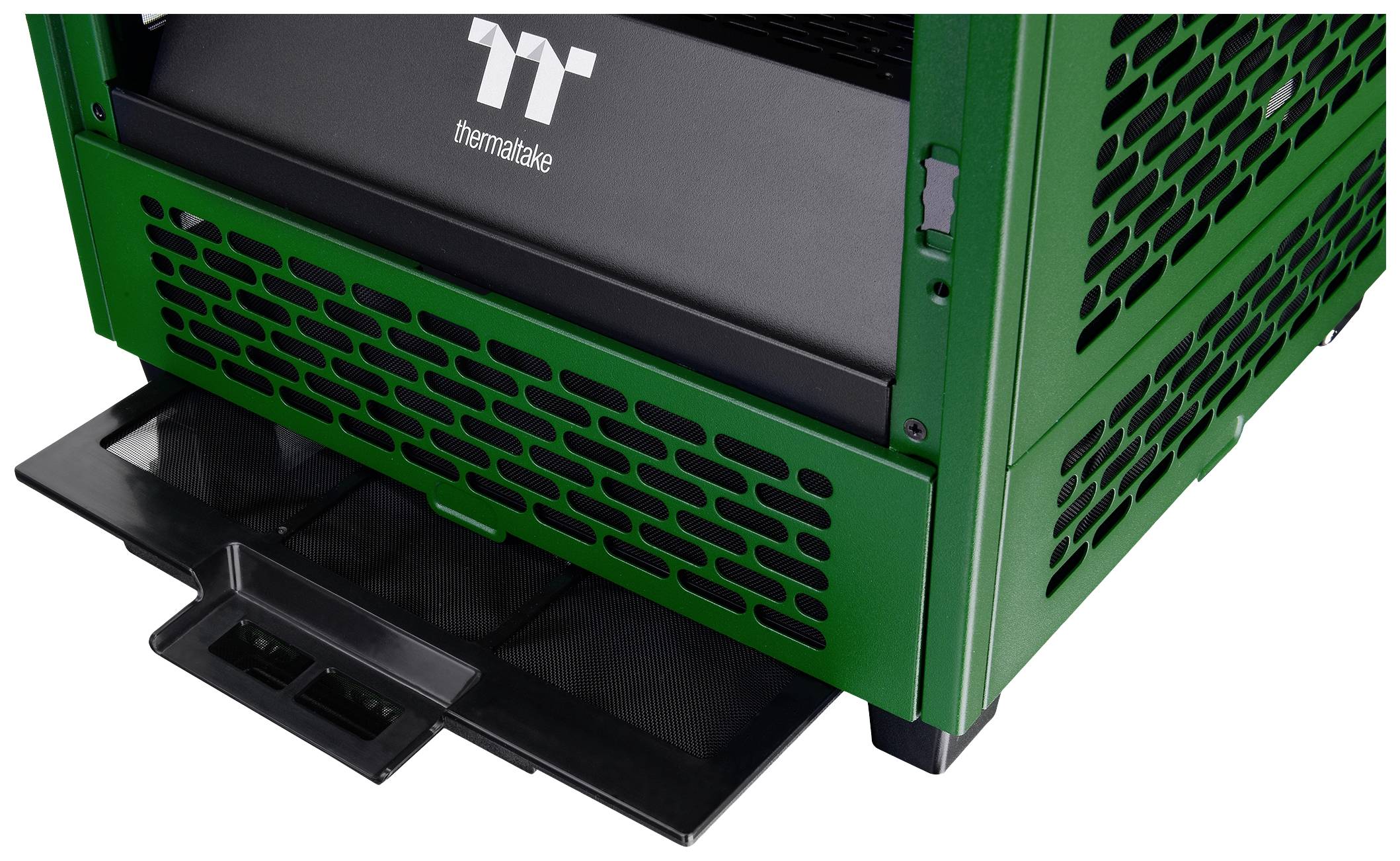 A green computer case with ventilation slots shows a pull-out cover on its underside.