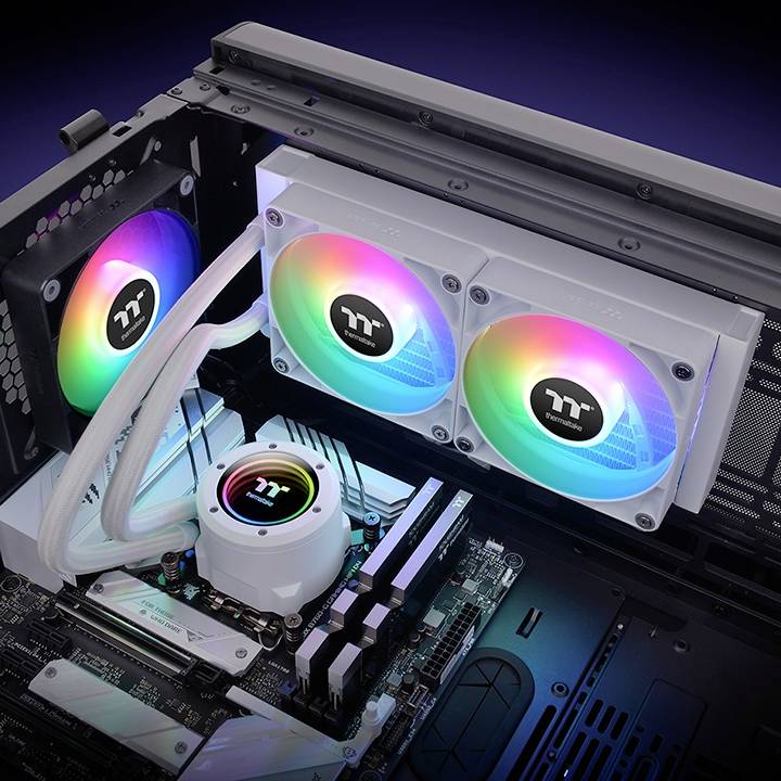 A computer case with an integrated water cooling system. Three fans glow in RGB colours, and tubes are connected to the cooling system.