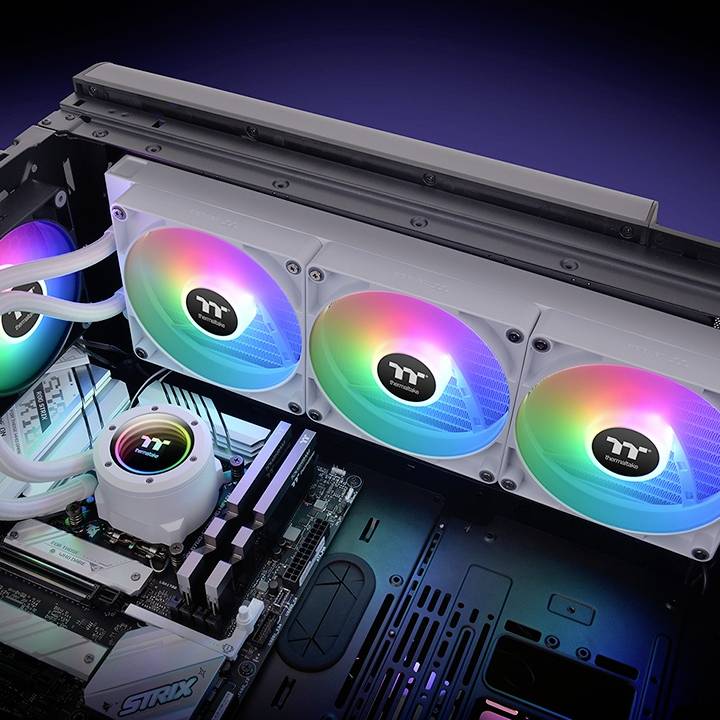 Computer case with colourful RGB lighting, showing fans and cooling components of a PC system, black with an intense light effect.