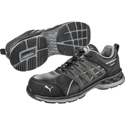 Black safety shoes with white logo, robust design and profiled sole for good grip. Ideal for industrial applications.