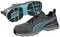 A pair of grey trainers with blue accents and a black sole, a close-up shot from the side and bottom.
