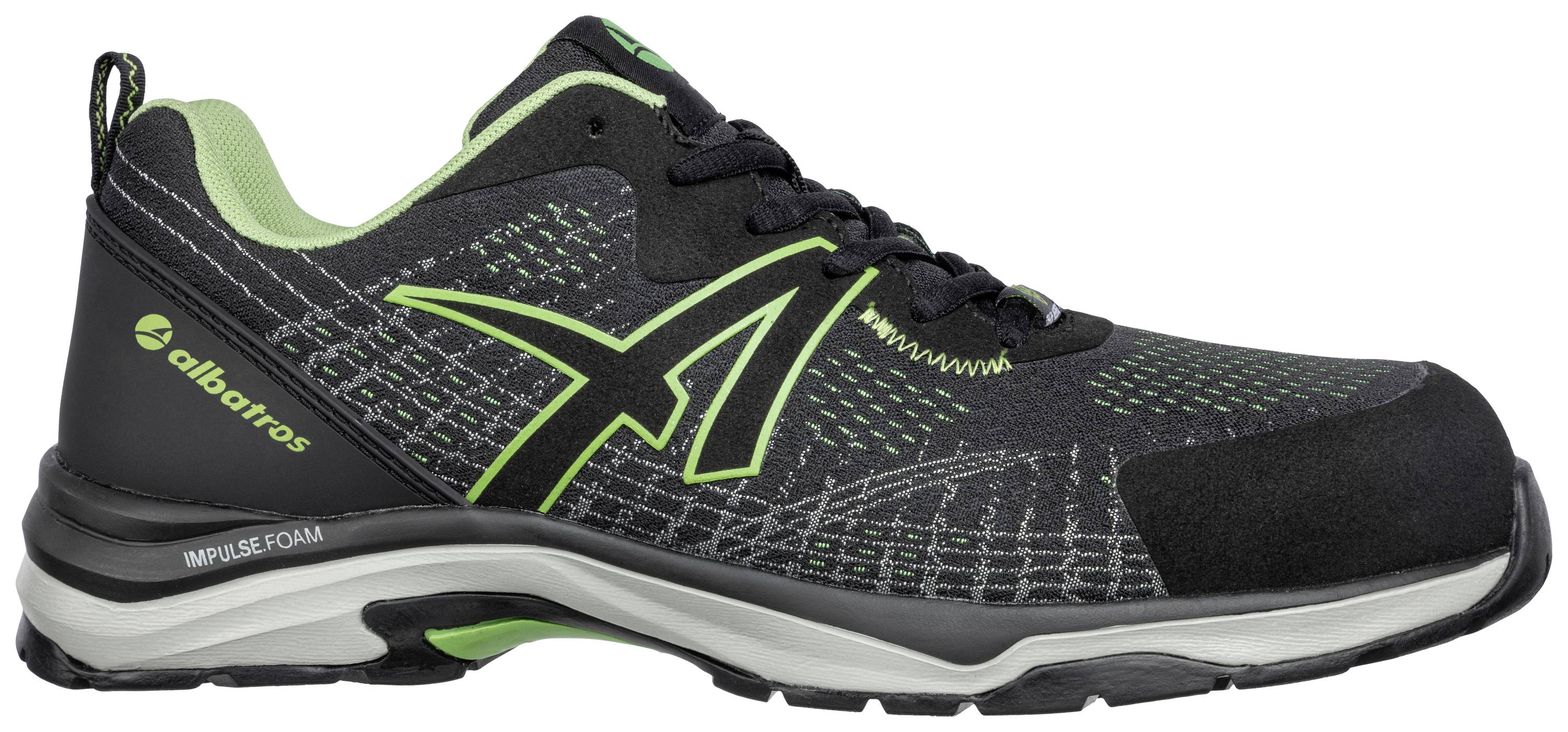 A black sports trainer with green highlights and a reinforced sole, suitable for outdoor activities. Brand logo on the side.