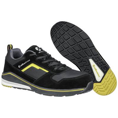 Black and yellow safety shoes with non-slip soles, a sporty design, and lace-up fastening. Suitable for work environments.