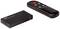 Black HDMI switcher with remote control. The switcher has three inputs and one button; the remote control has four round buttons.