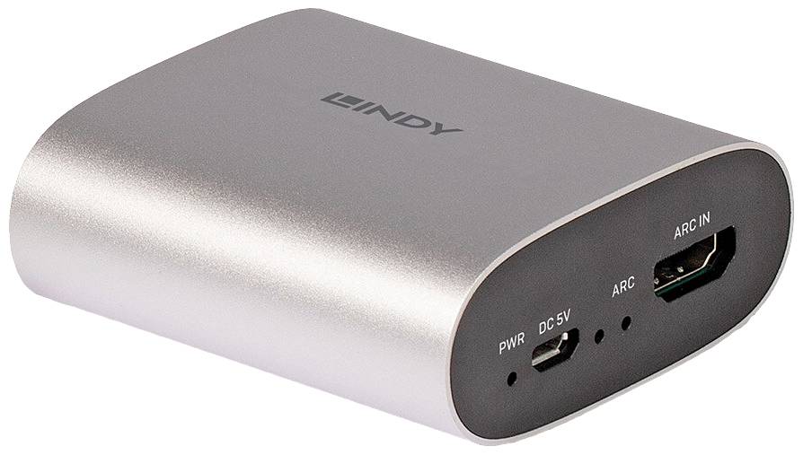 A silver electronic device with an HDMI port, USB power connection, and an inscription, displays connections for ARC and charging functionality.