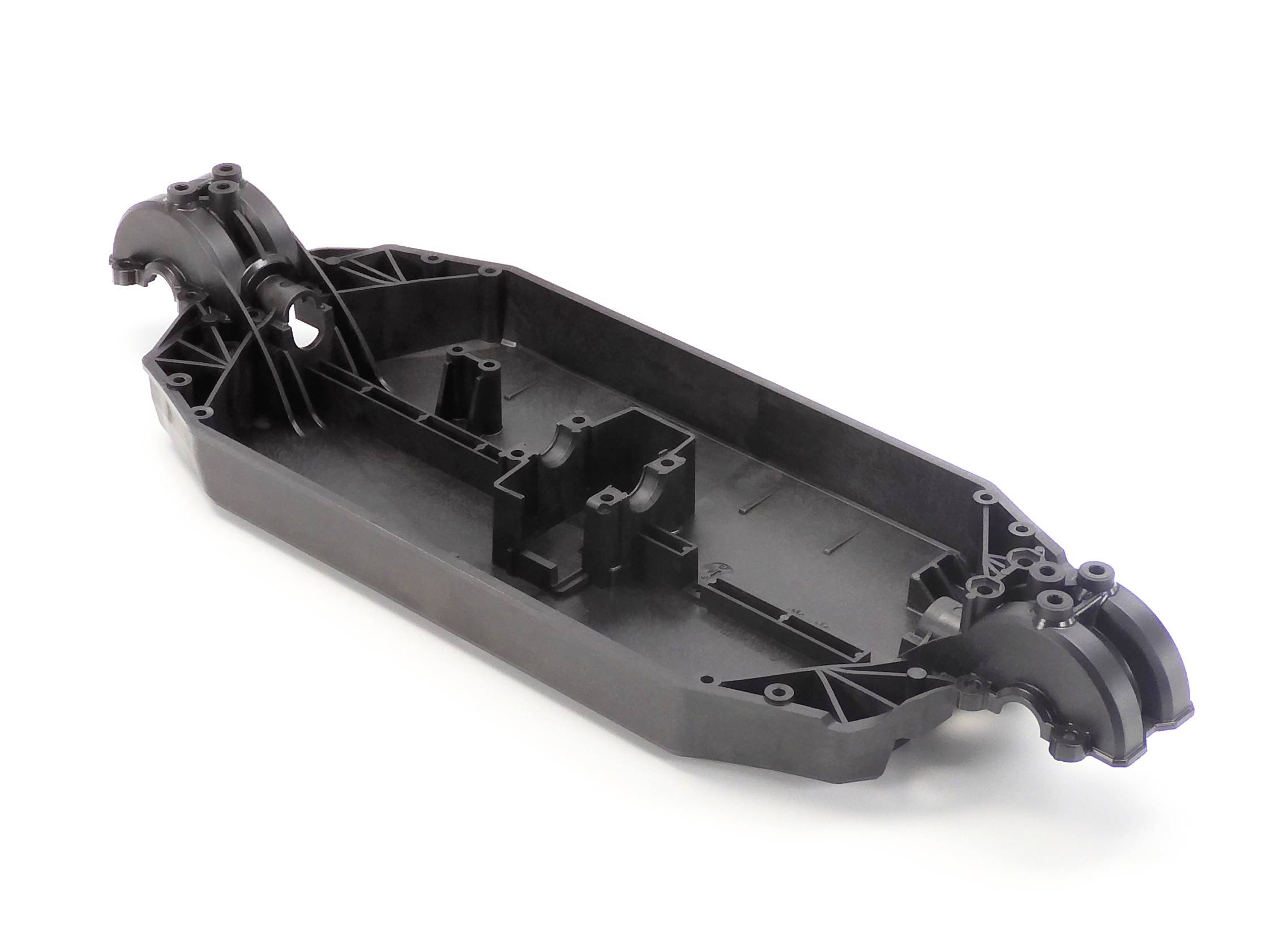 Black plastic chassis of a remote-controlled car, showing detailed view without electronic components or wheels.