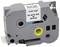 A grey ink ribbon cassette labelled '0.94"x26' BLACK INK ON WHITE', for printers or labelling devices.