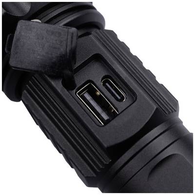 Close-up of a black device with USB ports. The focus is on the two ports positioned side by side, surrounded by a ribbed surface.