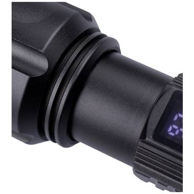 Close-up of a black torch with a digital display showing partial numbers. Focus on the torch and display.