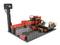 A model-building 3D printer in plastic, coloured red and black, with various cables mounted on a perforated base.