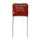 A red capacitor with the marking 'Suntan 2G474K', with two metal terminals at the bottom.