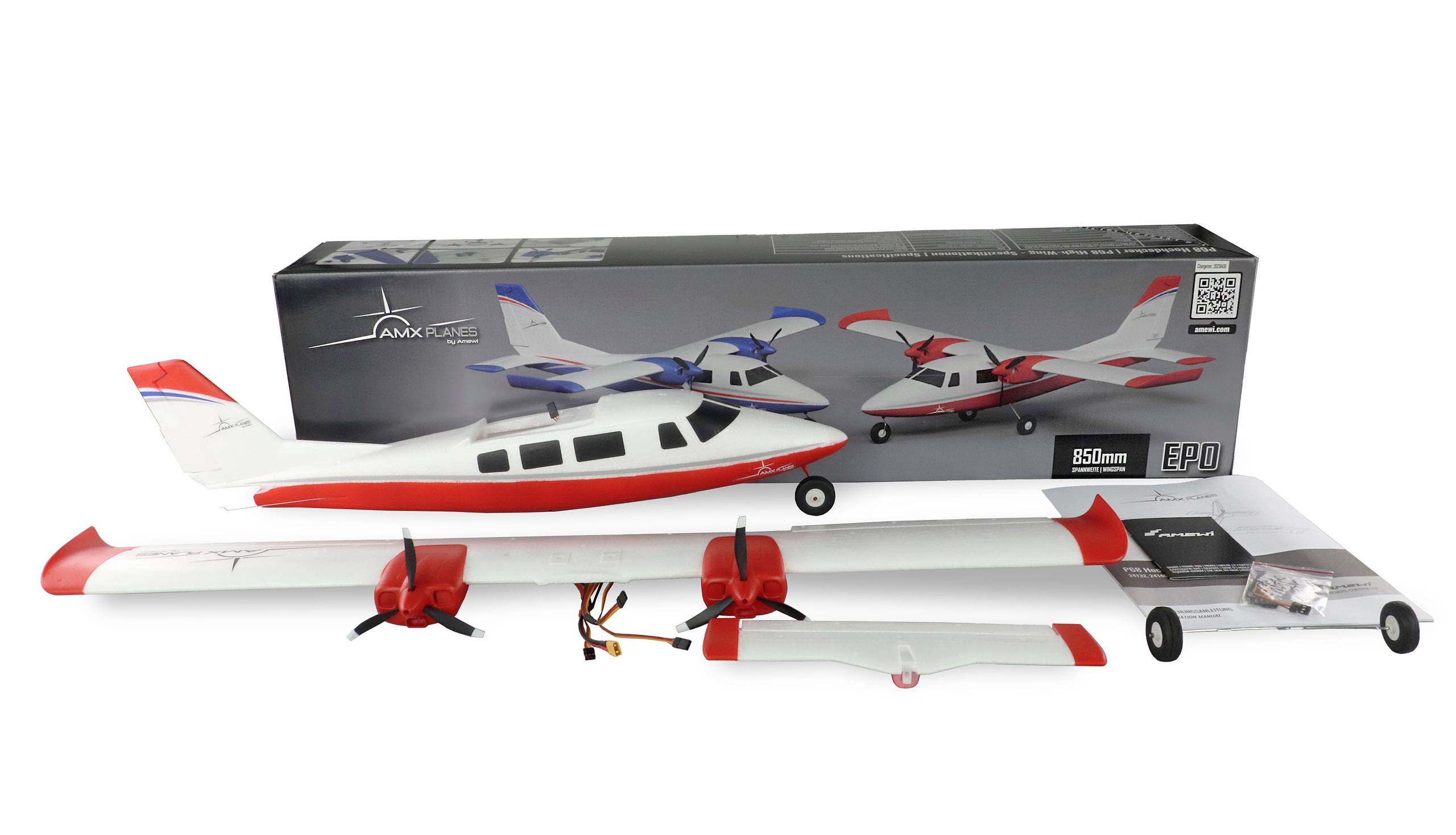 A model aircraft kit with a red and white aeroplane, assembled wings, propellers, and spare parts. Box with a picture of the aircraft in the background.